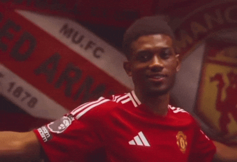 Man in Red Manchester United Jersey by Sign