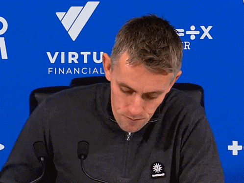 Man In Red Manchester United Jersey Next To Table GIF
