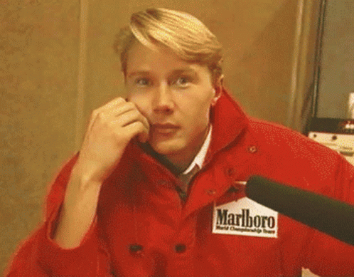 Man in Red Marlboro Jacket Covering Face