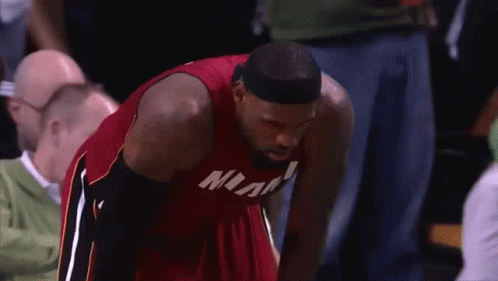 Man In Red Miami Jersey Looking Down GIF