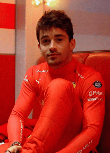 Man in Red Mille Shirt Sitting