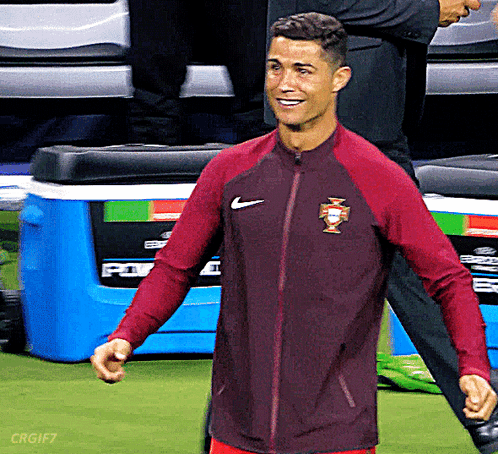 Man in Red Nike Jacket Soccer Field