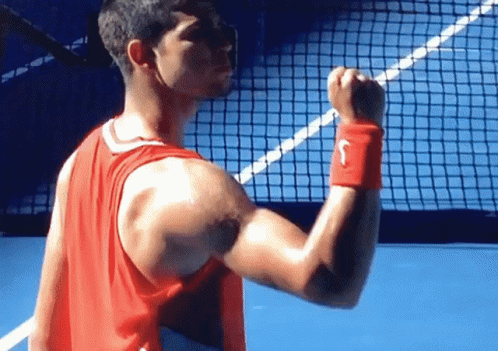 Man In Red Nike Tank Top Flexing GIF
