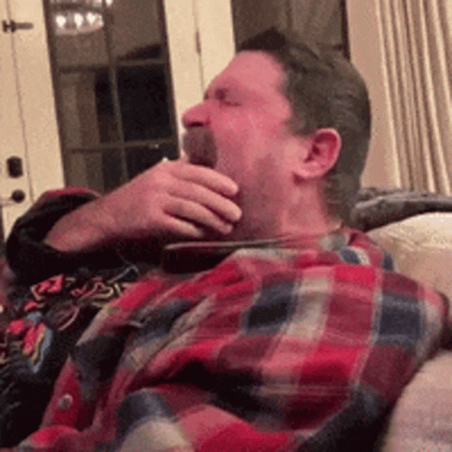 Man in Red Polo Shirt on Couch Saying She's Lying