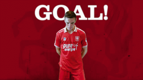 Man in Red Pure Energie Shirt Saying Goal