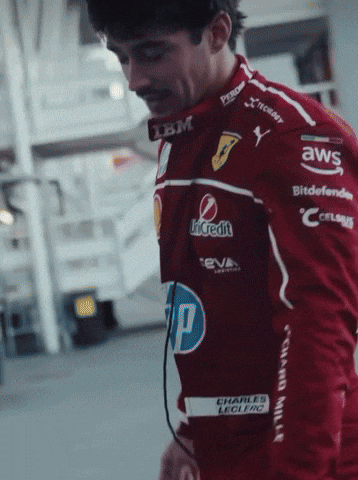 Man in Red Racing Jacket with Sponsors