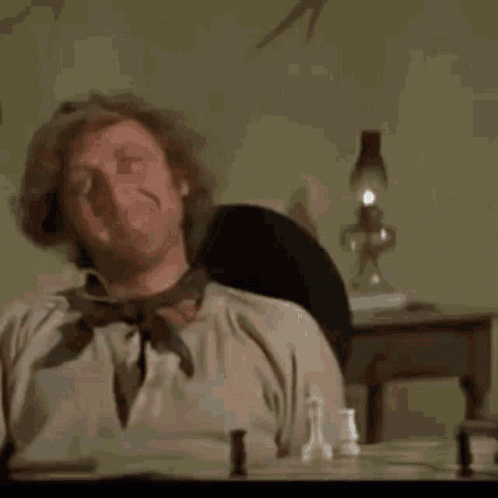 Man In Red Robe Next To Man In Black Robe GIF