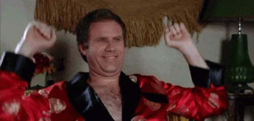 Man in Red Robe Raising Hands