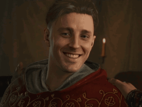 Man In Red Robe Smiling GIF