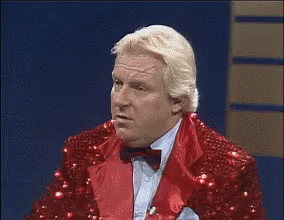Man in Red Sequined Suit and Bow Tie Funny Face