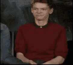Man In Red Shirt And Black Collar Close Up GIF