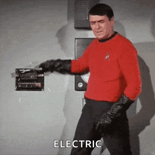 Man In Red Shirt And Black Gloves Says Electric GIF