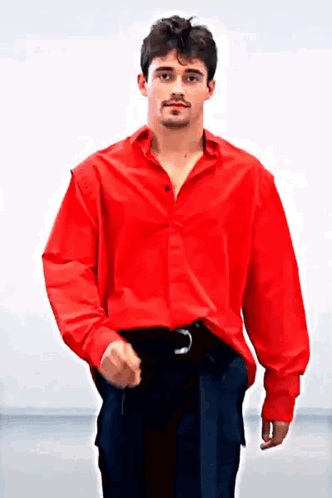 Man in Red Shirt and Black Pants