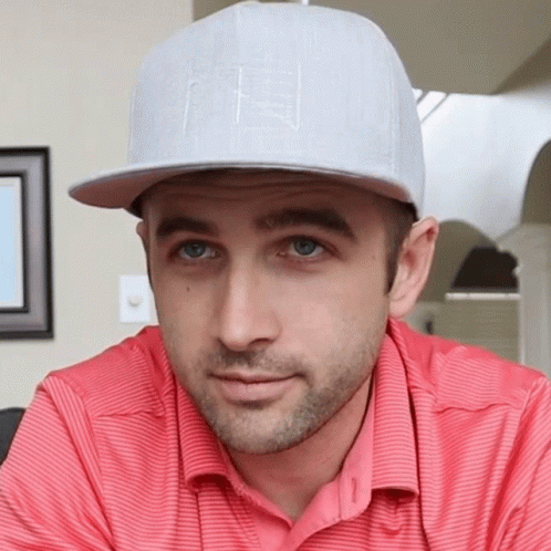 Man in Red Shirt and F Hat