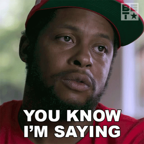 Man in Red Shirt and Hat Saying You Know I'm Saying