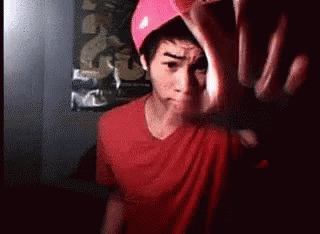 Man In Red Shirt And Pink Hat Making Funny Face GIF