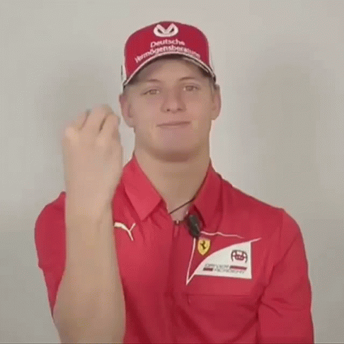 Man in Red Shirt and Red Hat Deutsche