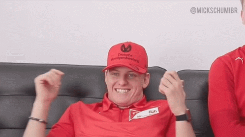 Man in Red Shirt and Red Hat Saying Deutsche Vermögensberatung