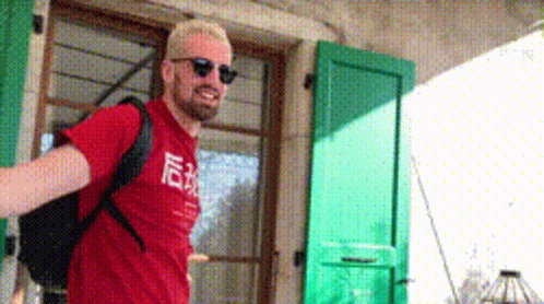 Man in Red Shirt and Sunglasses