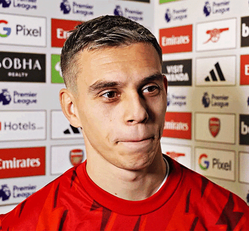 Man in Red Shirt by Emirates and G Pixel Logos
