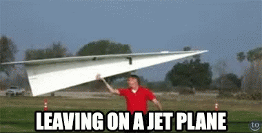 Man in Red Shirt Carrying Paper Airplane Leaving on a Jet Plane