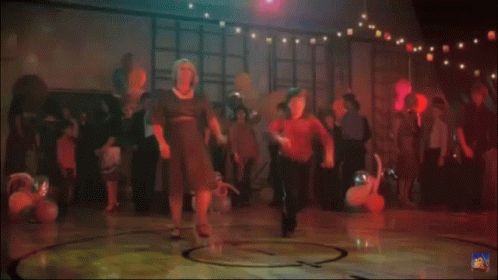 Man in Red Shirt Dancing at Party