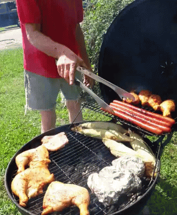Man in Red Shirt Grilling Chicken and Hot Dogs