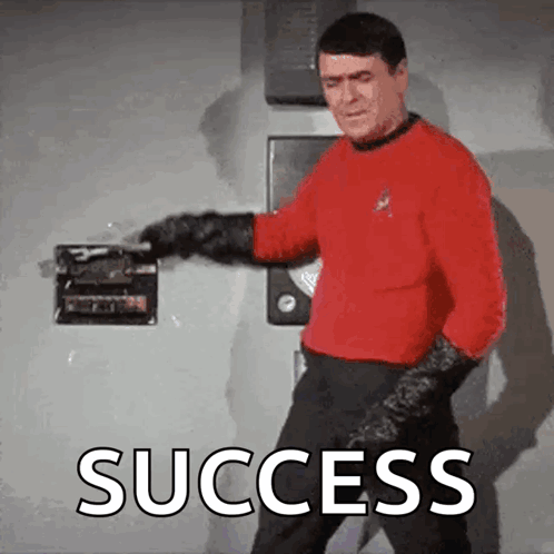 Man In Red Shirt Holding Box Saying Success GIF