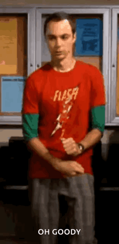 Man in Red Shirt Holding Lightning Bolt at Bulletin Board