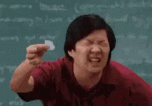 Man in Red Shirt Holding Paper