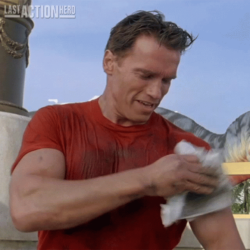 Man in Red Shirt Holding Paper Last Action Hero