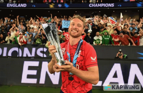 Man In Red Shirt Holding Trophy GIF