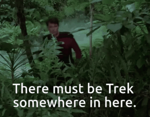 Man in Red Shirt in Forest Saying There Must Be Trek Somewhere in Here
