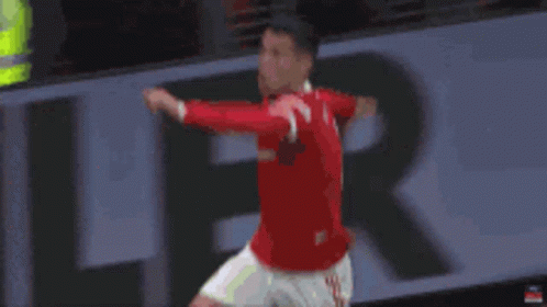 Man in Red Shirt Jumping Soccer