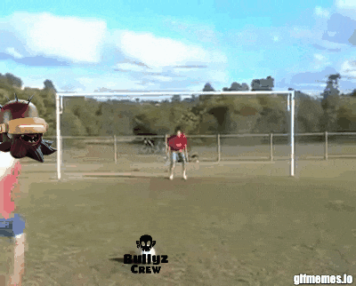 Man in Red Shirt Kicking Soccer Ball