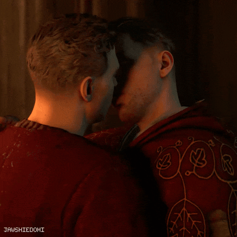 Man In Red Shirt Kissing Another Man In Front Of Jawshiedomi Sign GIF