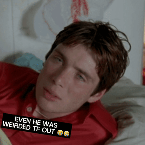 Man in Red Shirt Lying on Bed