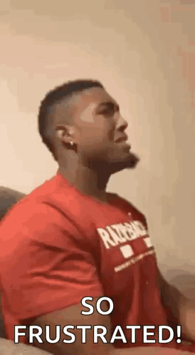Man in Red Shirt Making Face