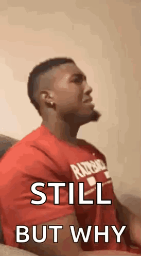 Man in Red Shirt Making Face on Couch