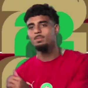 Man in Red Shirt Making Funny Face on Green Background