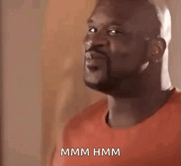 Man In Red Shirt Making Funny Face Saying Hmm Hmm GIF