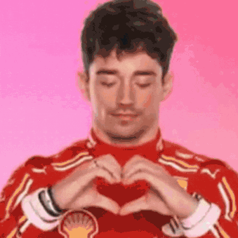 Man in Red Shirt Making Heart