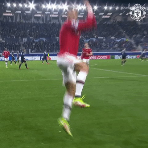 Man in Red Shirt Number 7 Jumping