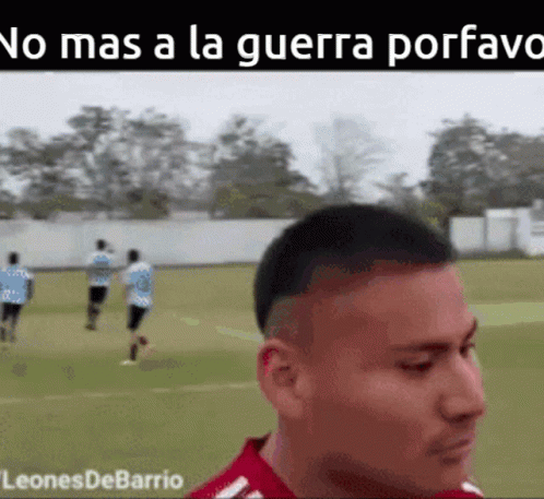Man in Red Shirt on Soccer Field