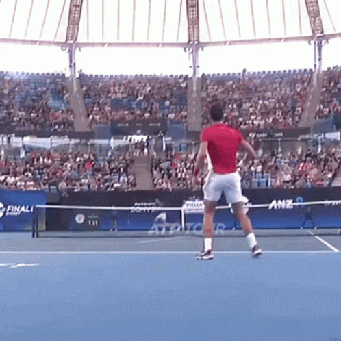 Man in Red Shirt Playing Tennis