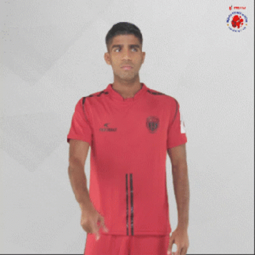 Man In Red Shirt Pointing At Mouth GIF