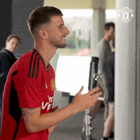 Man In Red Shirt Saying Fly Emirates GIF
