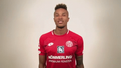 Man in Red Shirt Saying Kömmerling Premium Fenster