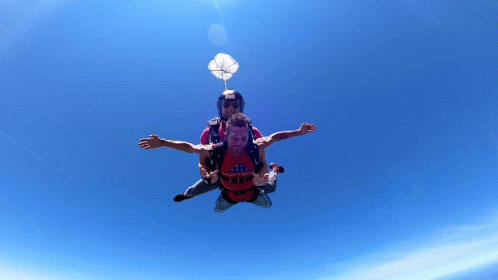 Man in Red Shirt Saying Mighty Flying With Another Man