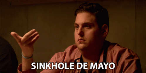 Man in Red Shirt Saying Sinkhole De Mayo
